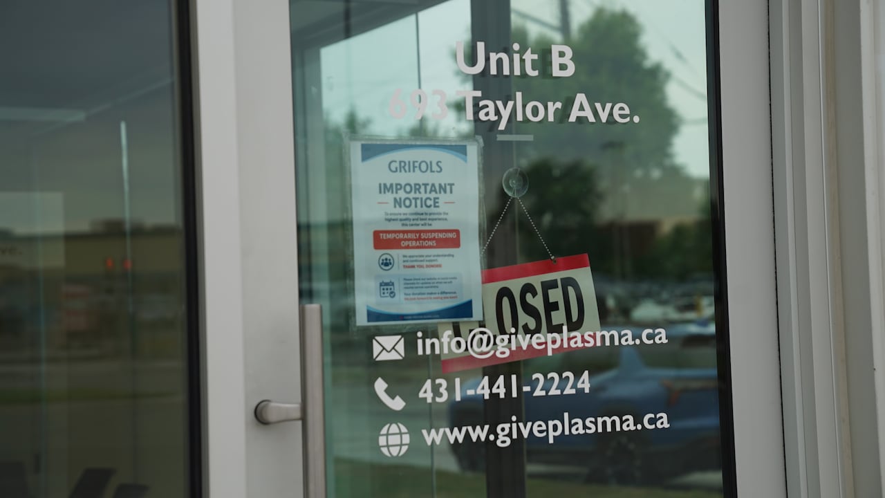 A sign on the front door of a business warns users of a temporary suspension of operations.