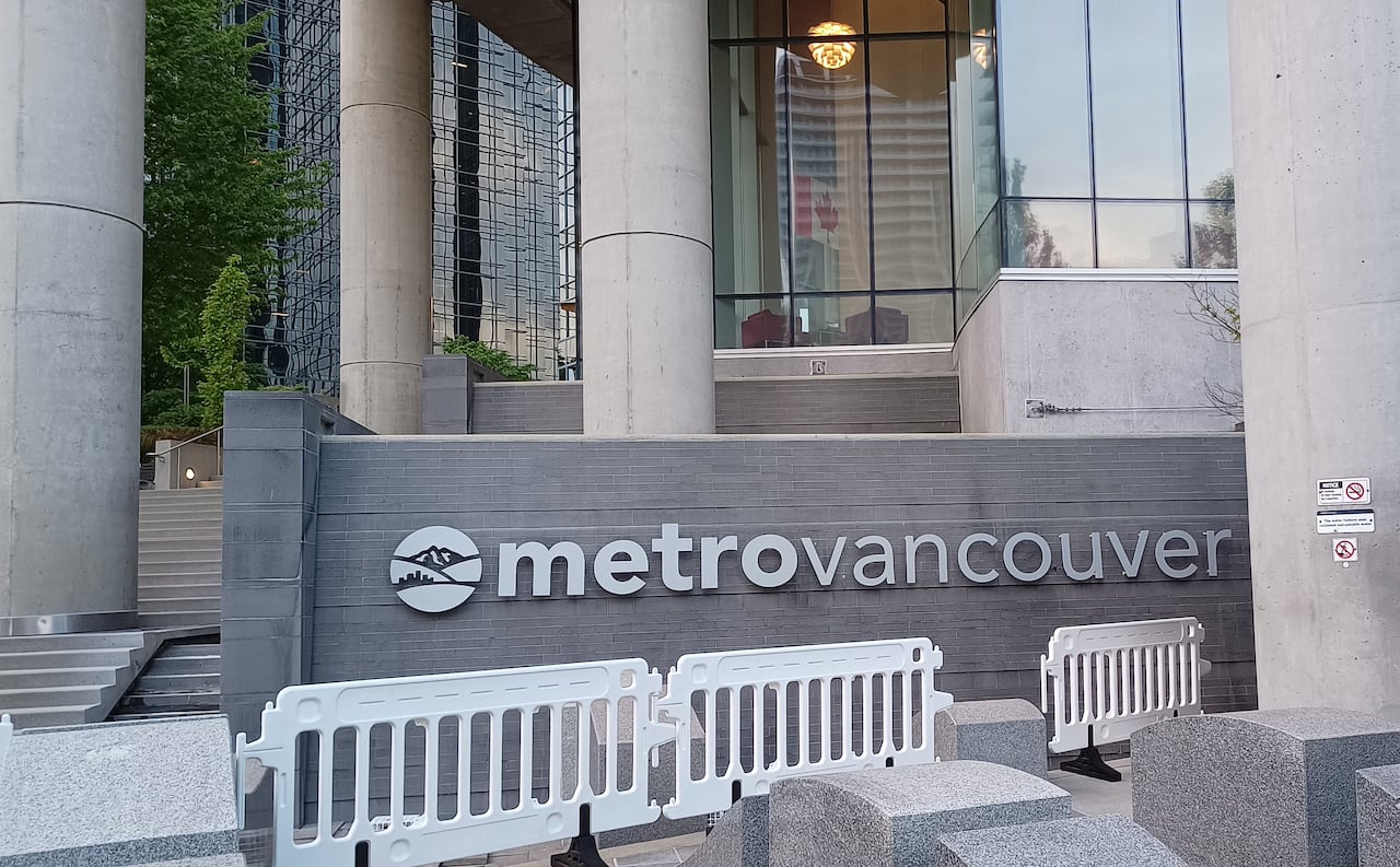 A sign says 'Metro Vancouver' on an office building.