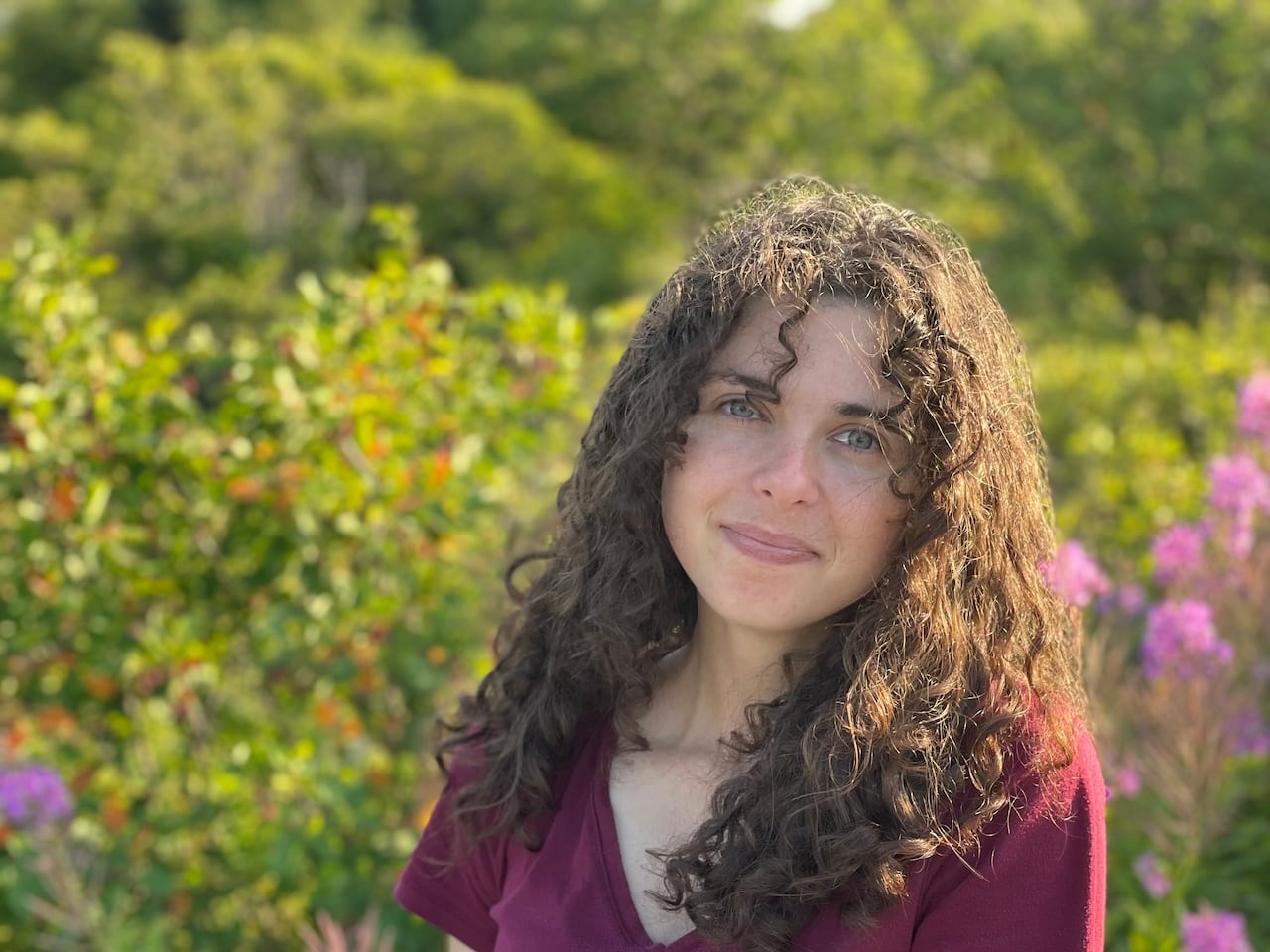 A woman poses for a photo.
