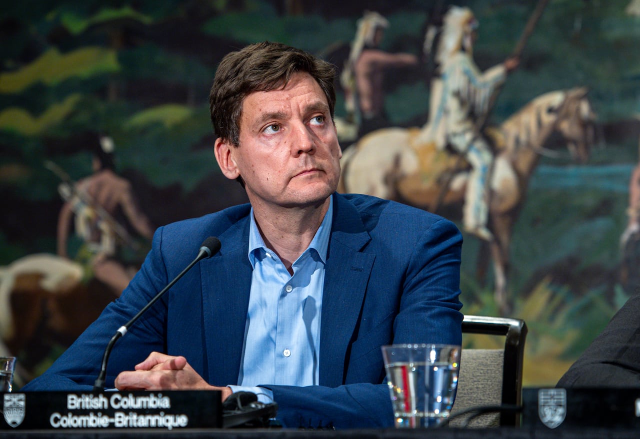 B.C. Premier David Eby listens to a speaker at a closing news conference of a meeting of western premiers