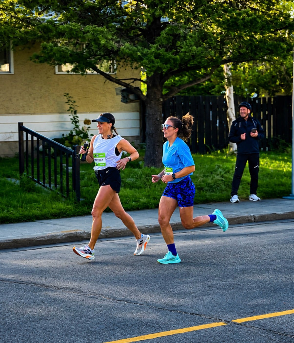 Two women are running side by side.