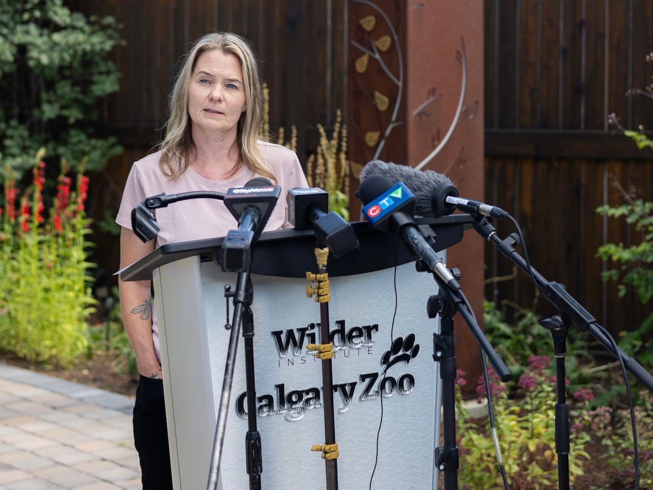 A woman speaks at a podium.