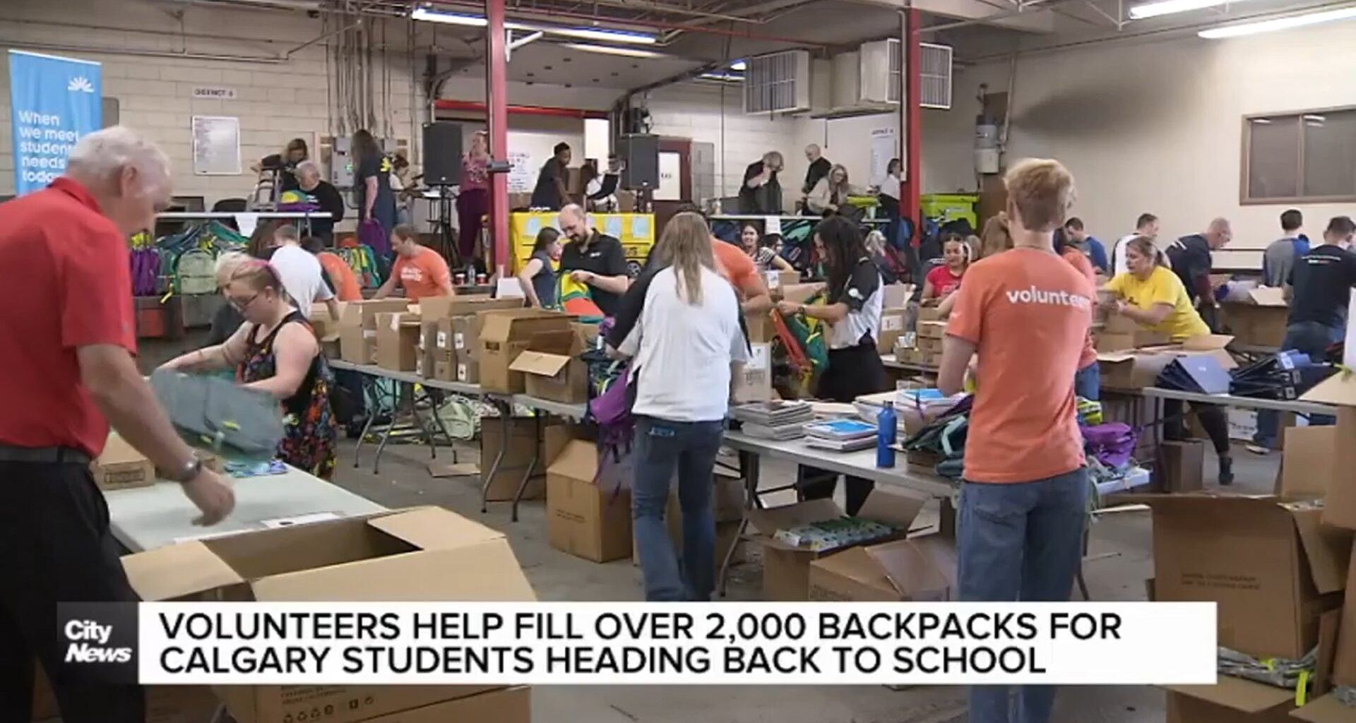 Volunteers help fill over 2,000 backpacks for Calgary students heading back to school