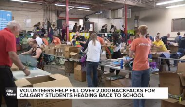 Volunteers help fill over 2,000 backpacks for Calgary students heading back to school