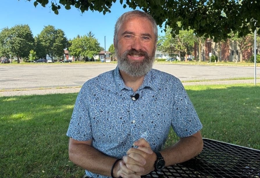 A man smiling.