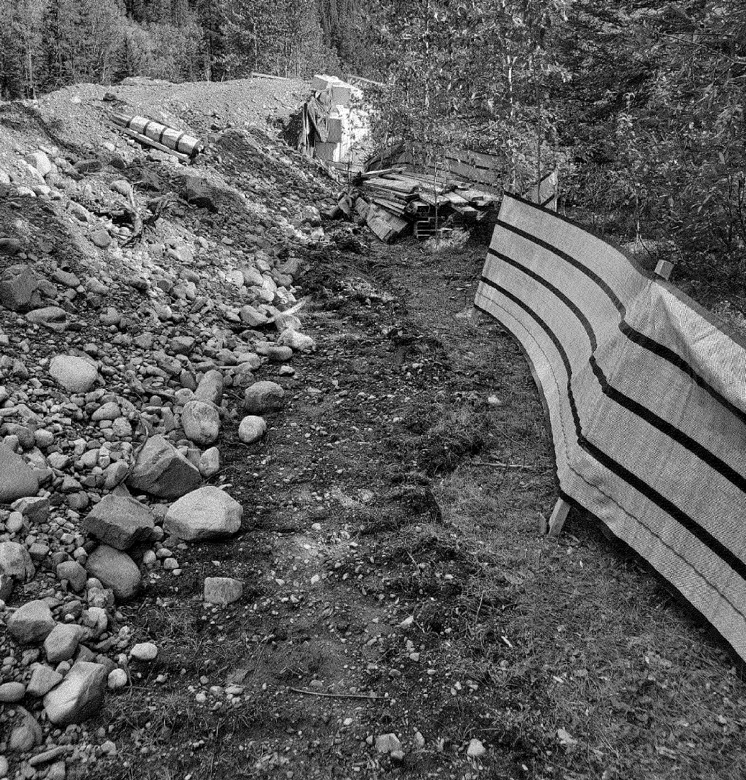 A disturbed critical habitat area near a river.