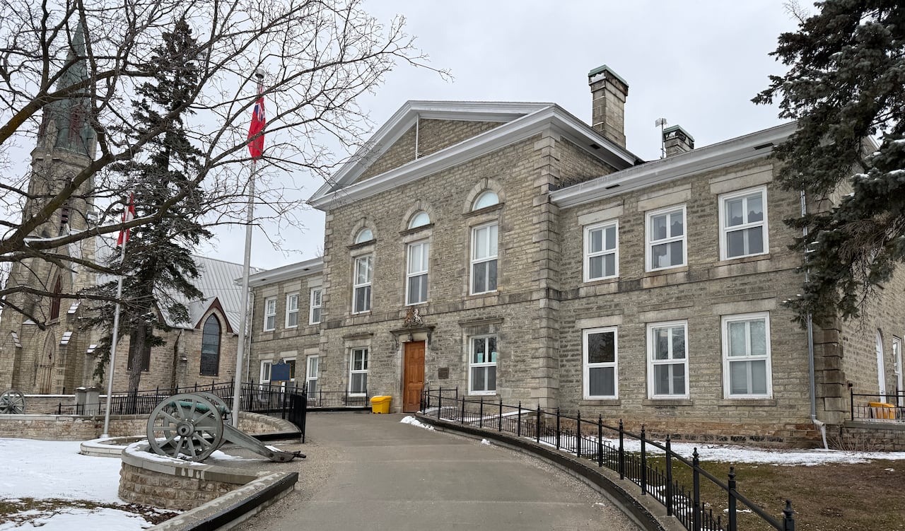 A small town courthouse on a cloudy day at the end of winter.