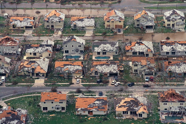 Rows of damaged houses sit between Homestead and Florida City, Fla., Aug. 25, 1992. (AP Photo/Mark Foley, File)