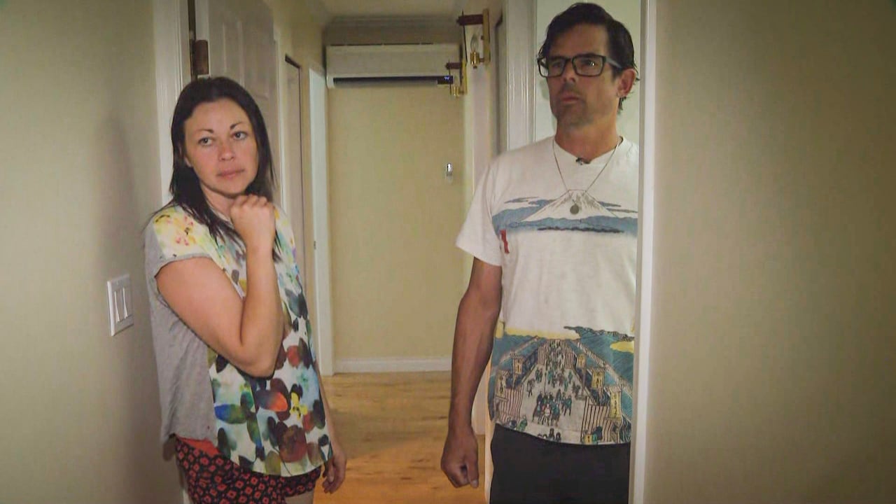 man and woman in hallway