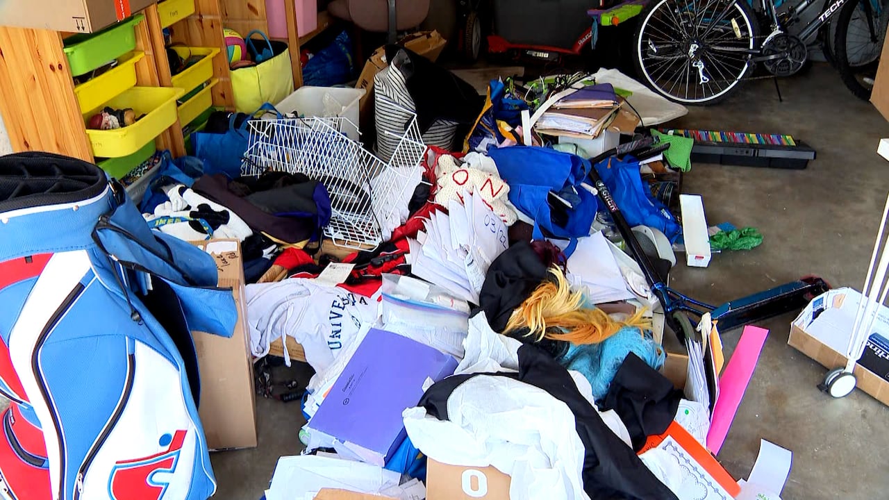 A ransacked garage with debris strewn about.