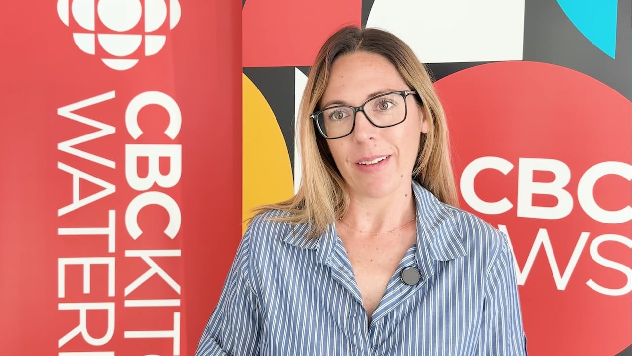 woman with a cbc banner behind her