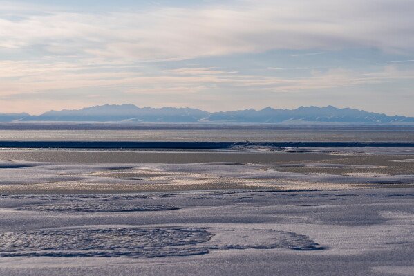 The Kaktovik Lagoon and the Brooks Range mountains of the Arctic National Wildlife Refuge are visible in the distance, Tuesday, Oct. 15, 2024, in Kaktovik, Alaska. (AP Photo/Lindsey Wasson, File)