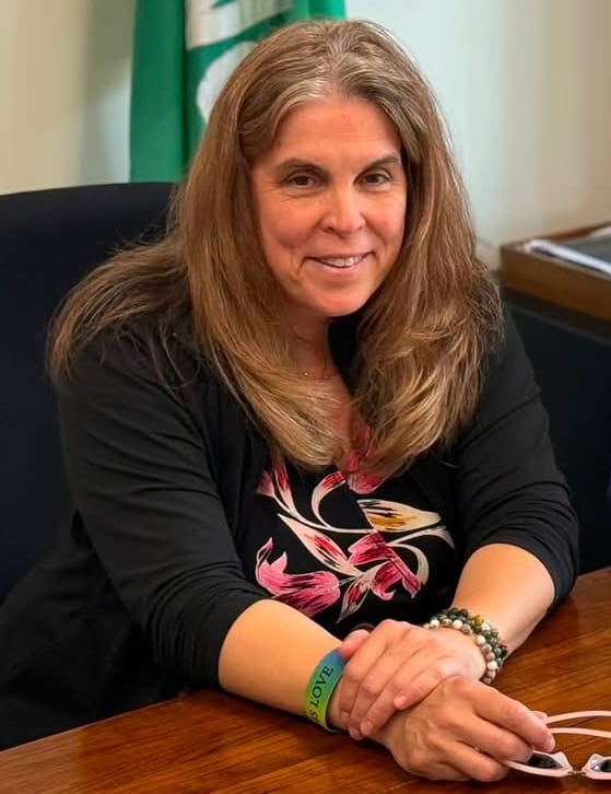 A female politicians sits for a portrait photo.
