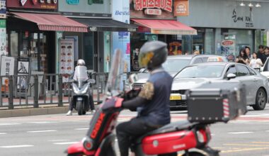 A food delivery worker rides a motorcycle through Seoul, July 8. Yonhap