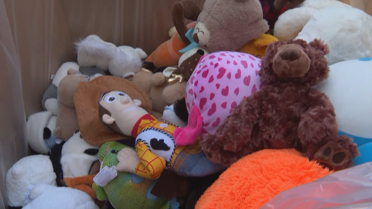 A large boxed filled with stuffed animals