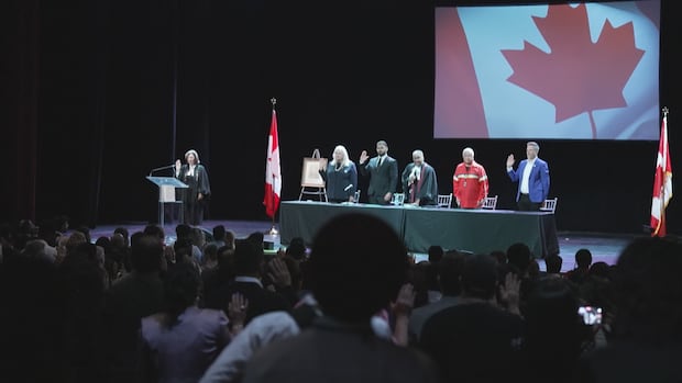 'Harmony between people is stronger than any tariffs': New Canadian citizens take oath at CNE amid trade war
