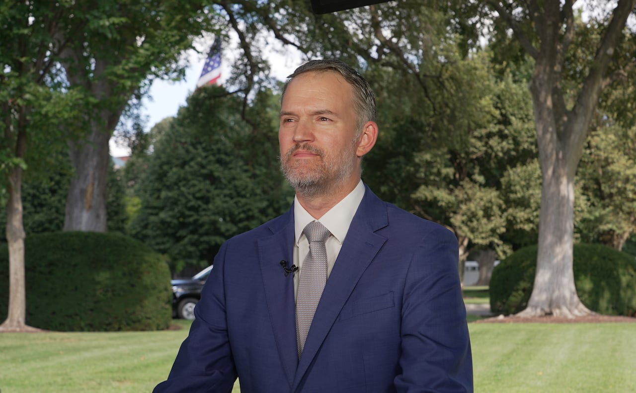 A man in a suit outside.