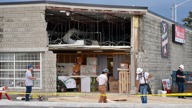 Vehicle smashes into Gloucester store, 2 used lawnmowers stolen