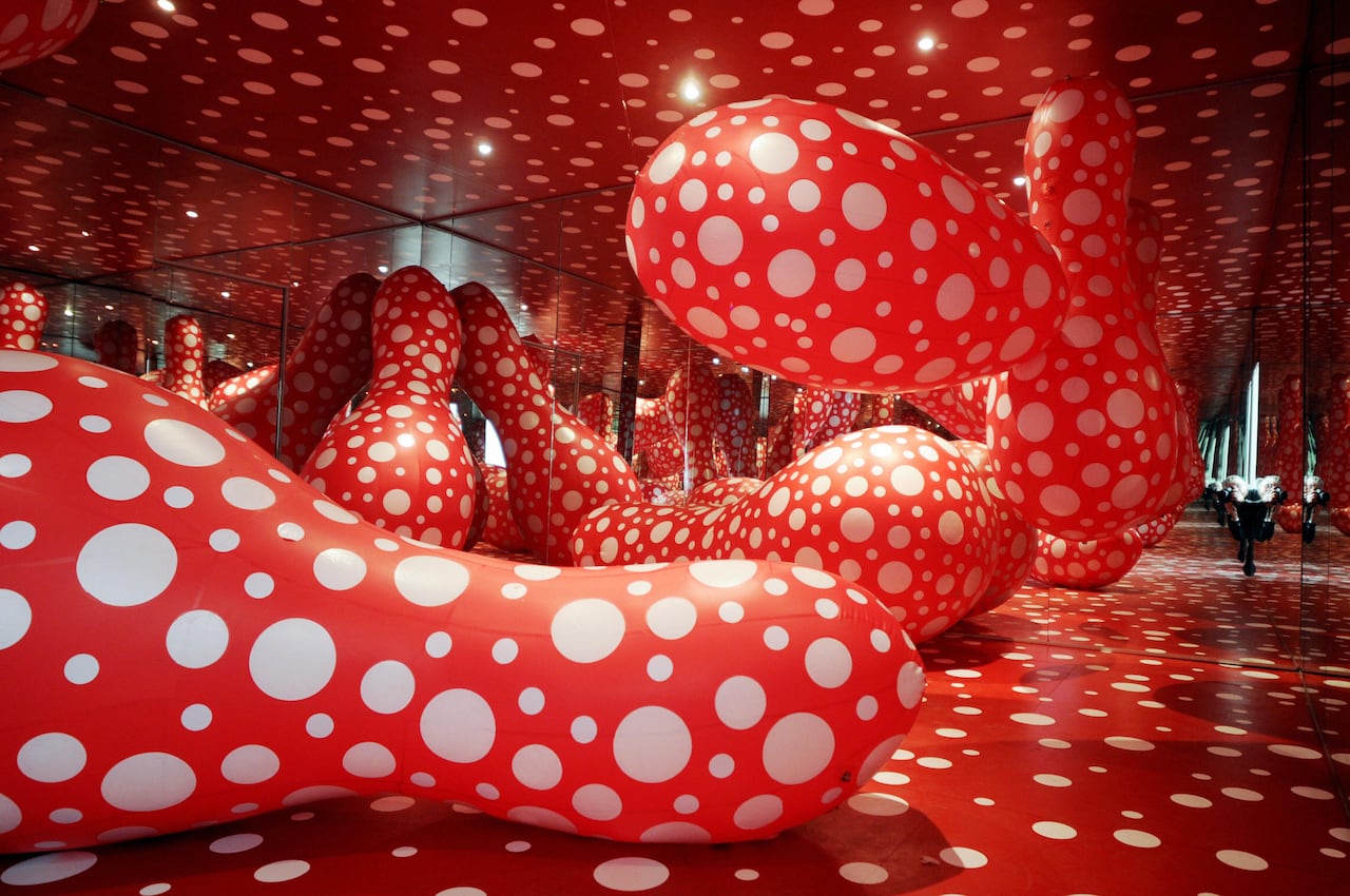 A picture of a red installation covered in white polka dots