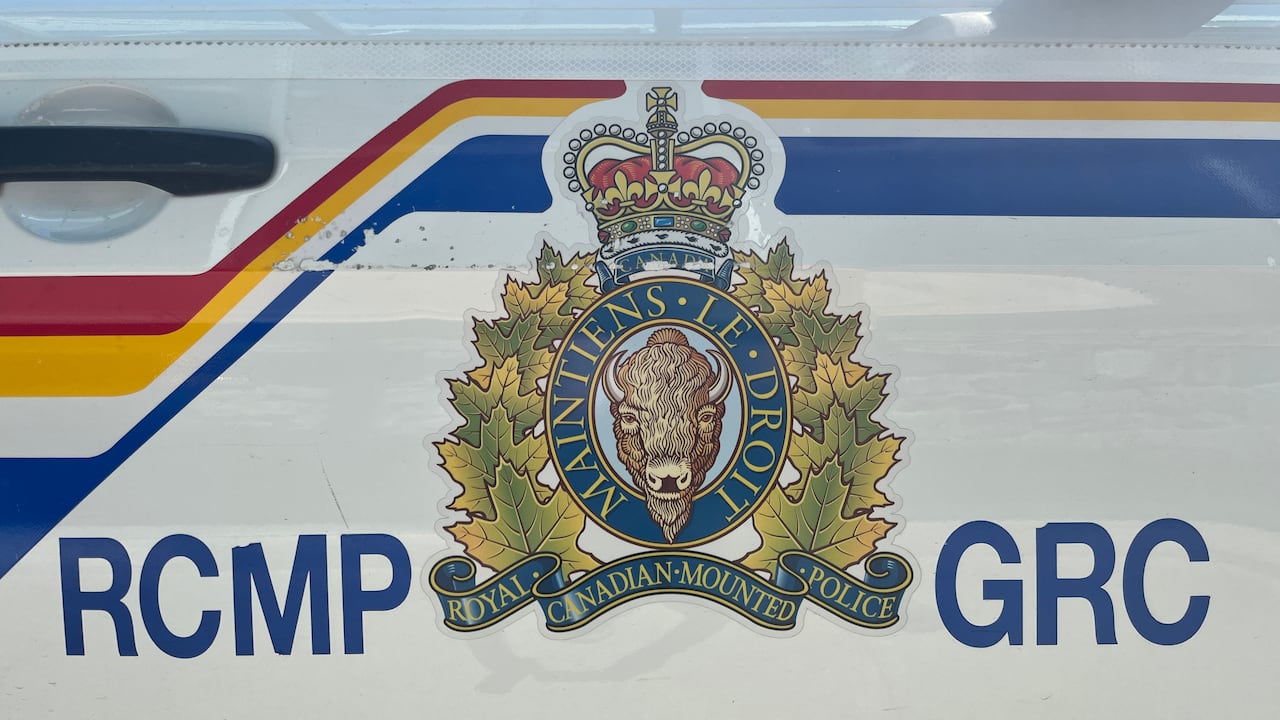 RCMP and GRC written on either side of a coat of arms on a white vehicle.