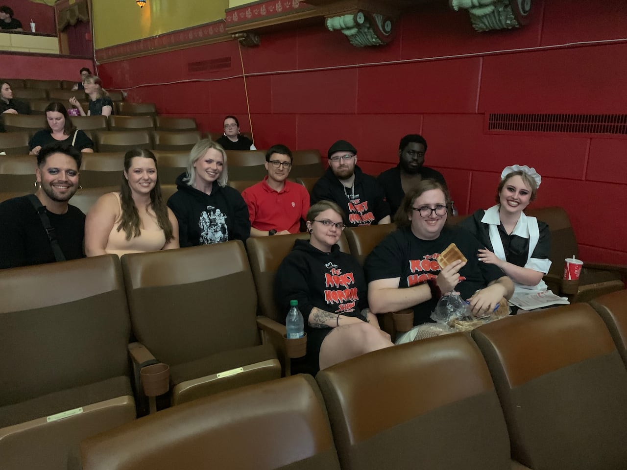 People sit in a theatre.