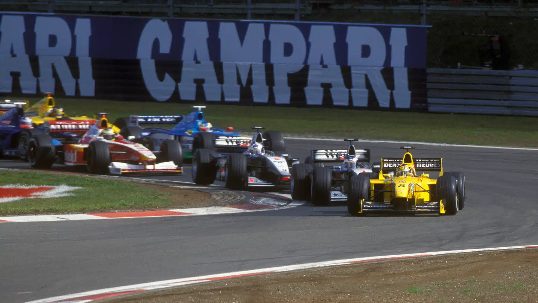Heinz-Harald Frentzen (Jordan-Mugen) leads McLaren-Mercedes drivers Mika Hakkinen and David Coulthard into the first corner in the 1999 European Grand Prix