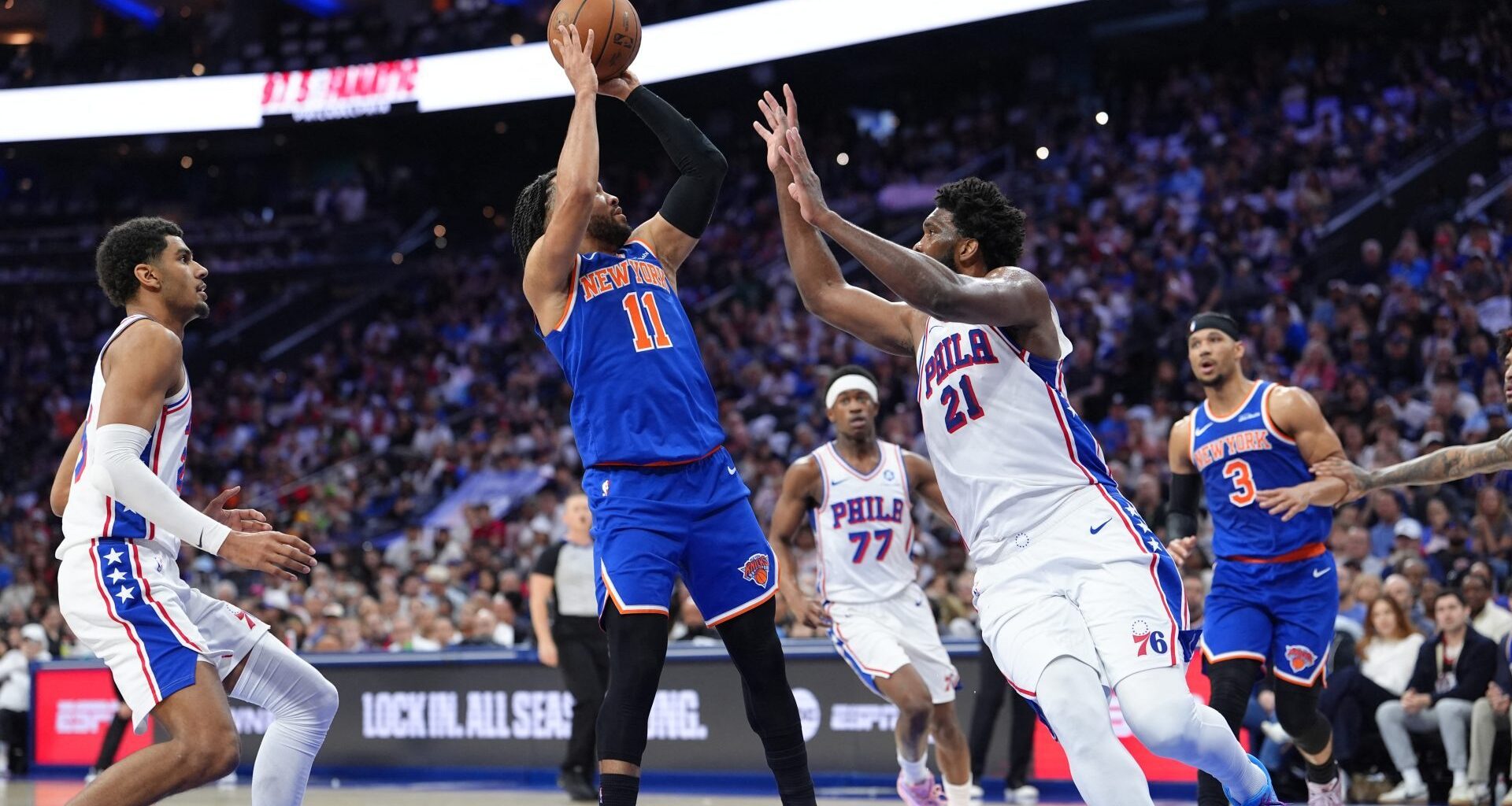 May 10, 2026; Philadelphia, Pennsylvania, USA; New York Knicks guard Jalen Brunson (11) shoots the ball against Philadelphia 76ers center Joel Embiid (21) in the second quarter during game four of the second round of the 2026 NBA Playoffs at Xfinity Mobile Arena.