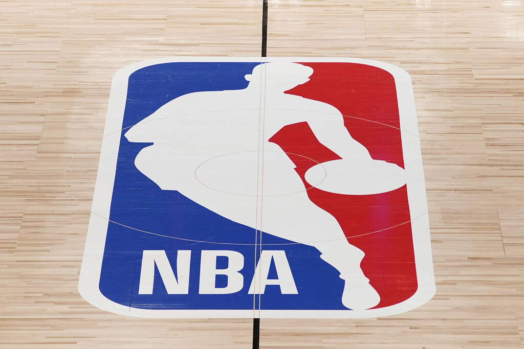 The NBA logo in shown on a basketball court in Lake Buena Vista, Fla., Friday, Aug. 28, 2020.(A ...