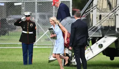 US President Donald Trump and aide Natalie Harp exit Marine One on the Ellipse near the White House on Aug  16.