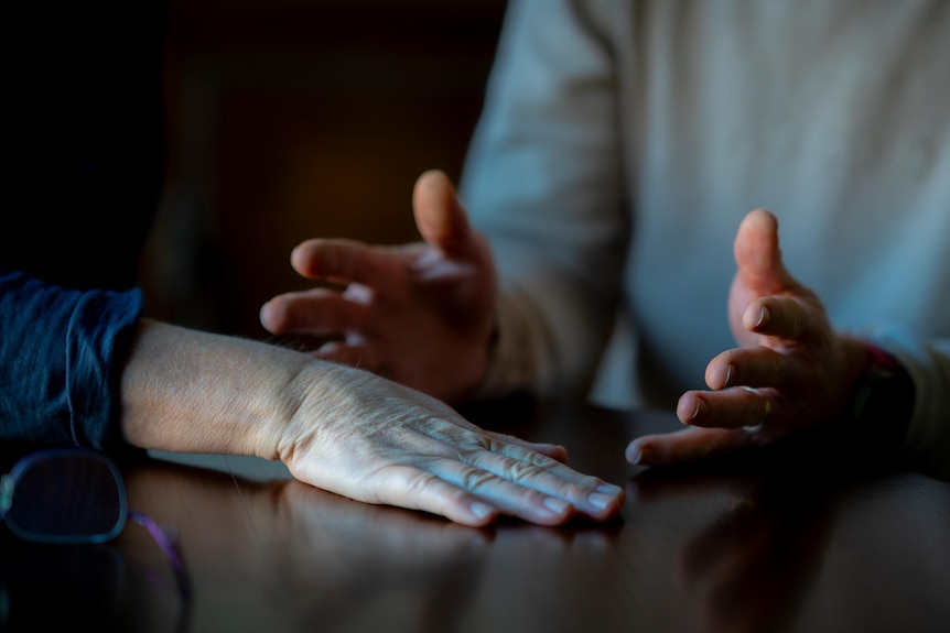 Two people's hands.