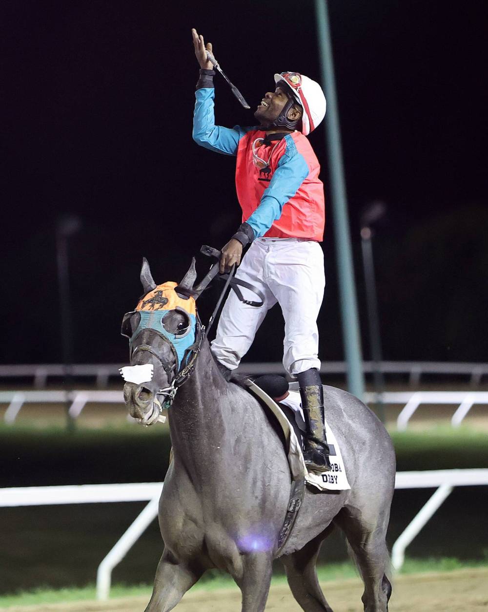 JASON HALSTEAD / ASSINIBOIA PHOTO
Western Warrior’s jockey Dane Nelson celebrates winning the Manitoba Derby Monday night at Assiniboia Downs.