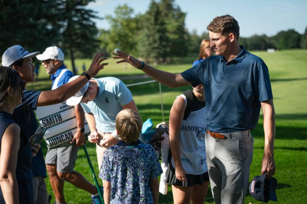 MEG ROBINSON OF PGA TOUR AMERICAS
Daniel Svard, of Sweden, acknowledges some fans at the Manitoba Open on Saturday.