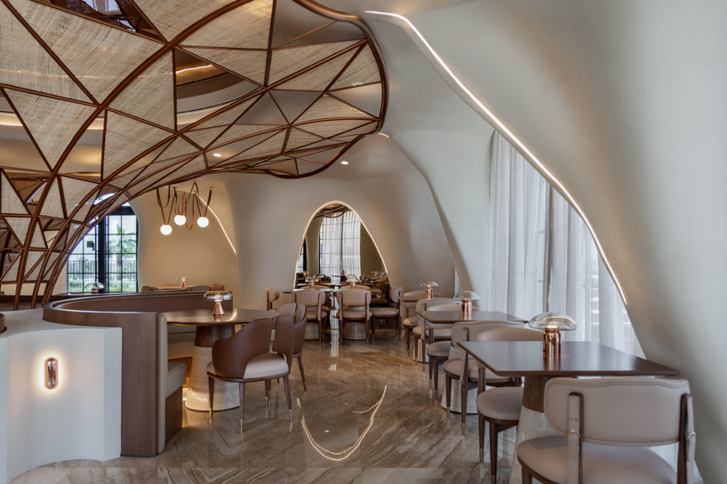 falwa restaurant transforms arabian equestrian heritage into fluid architectural interior - 2