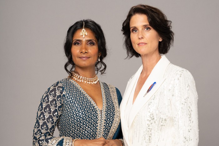 500482,EastEnders Eve dressed in a white suit and Suki wearing a saree in a wedding promo for EastEnders