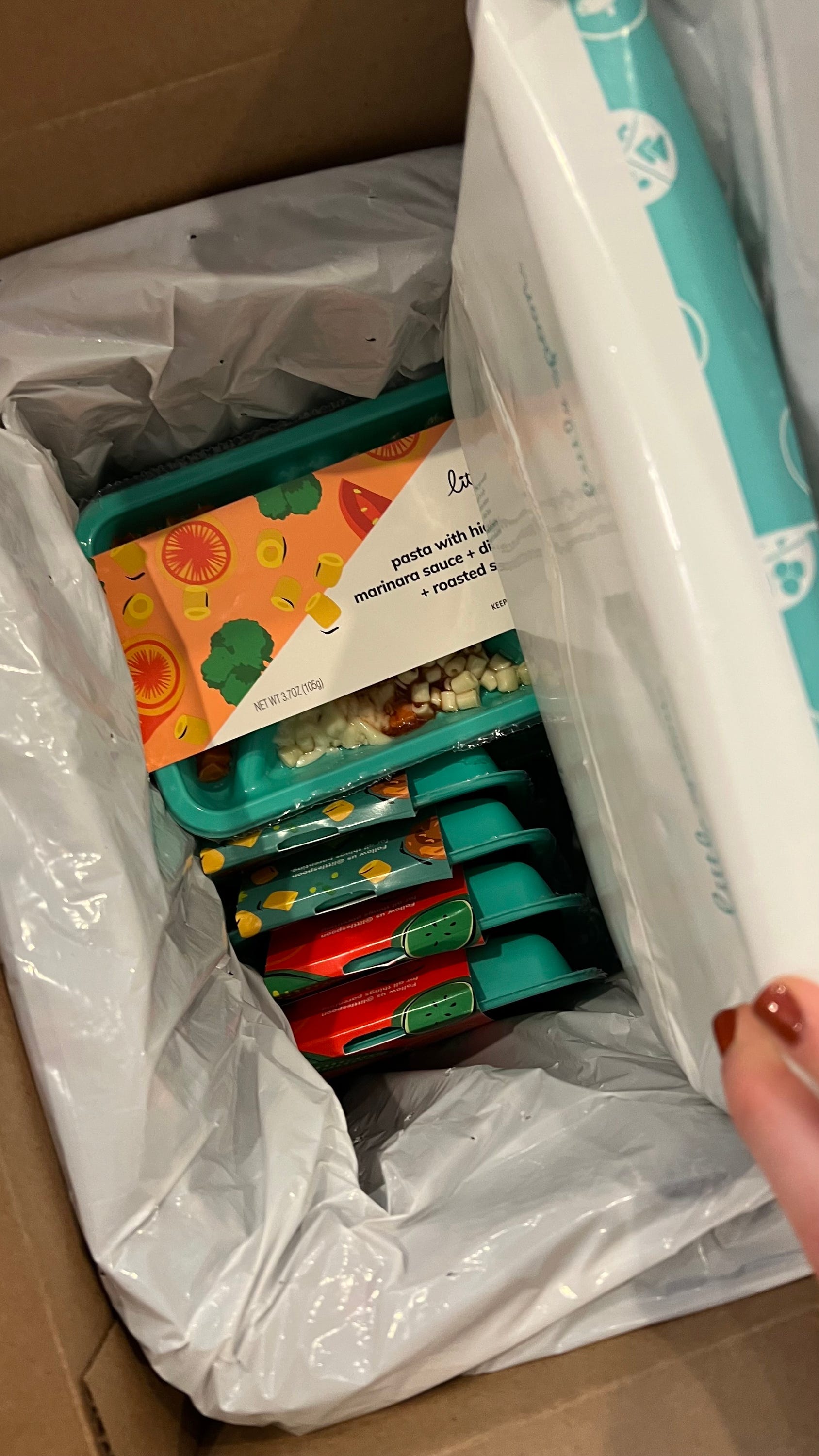 inside little spoon delivery box with meals