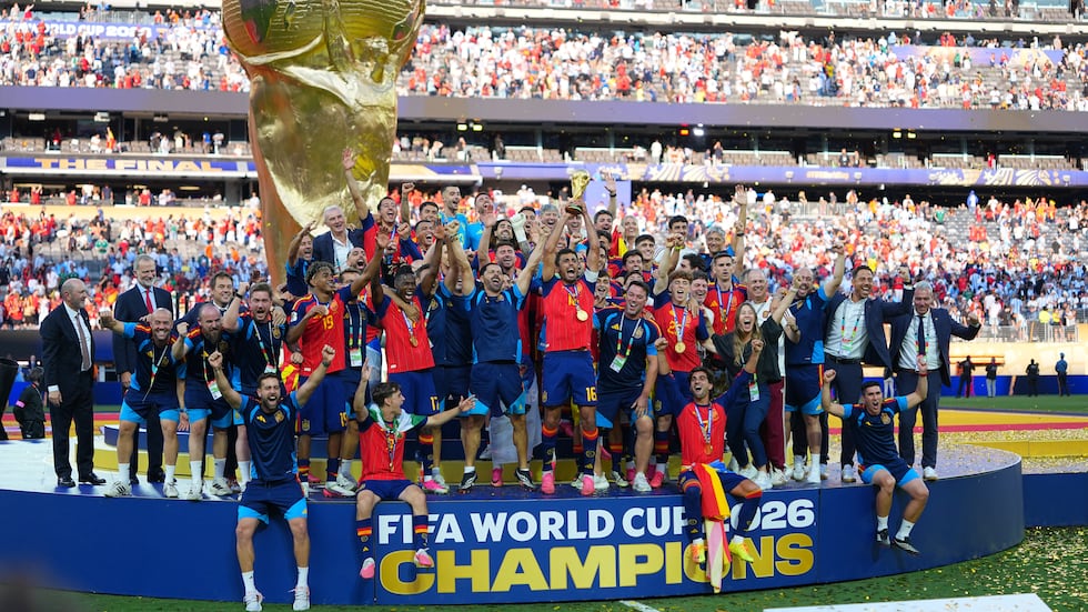 FILE -- Spain's Rodri (16) lifts the trophy as the team celebrates winning the World Cup final...
