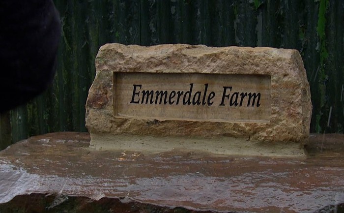 Emmerdale Farm Stone sign reading "Emmerdale Farm"