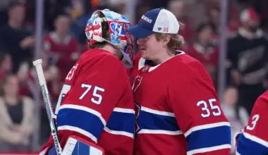 Montreal Canadiens goalie Jakub Dobes (75) celebrates the win against the Washington Capitals with teammate goalie Sam Montembeault (35) at the Bell Centre.