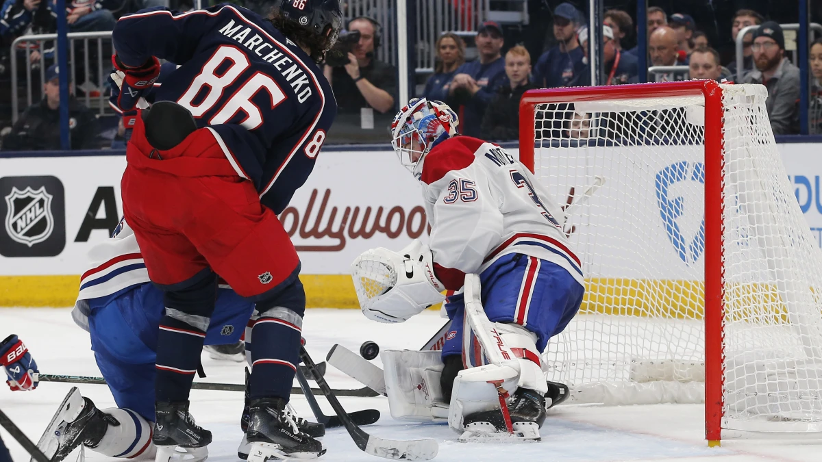 Montreal Canadiens goalie Sam Montembeault (35) makes a save as Columbus Blue Jackets right wing Kirill Marchenko (86) looks for a rebound during the second period at Nationwide Arena.