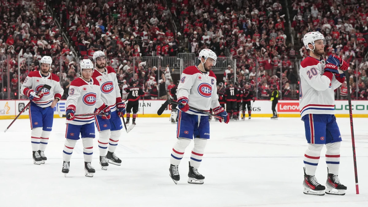 Montreal Canadiens left wing Juraj Slafkovsky (20) skates toward goaltender Jakub Dobes (not pictured) with center Nick Suzuki (14), right wing Cole Caufield (13), right wing Josh Anderson (17) and left wing Alexandre Texier (85) after losing to the Carolina Hurricanes in game five of the Eastern Conference Final of the 2026 Stanley Cup Playoffs at Lenovo Center.
