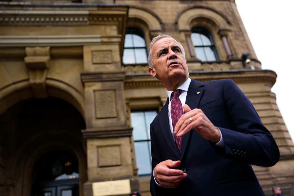 Prime Minister Mark Carney makes a statement outside the Office of the Prime Minister and Privy Council in Ottawa, on Tuesday, July 21, 2026. THE CANADIAN PRESS/Justin Tang