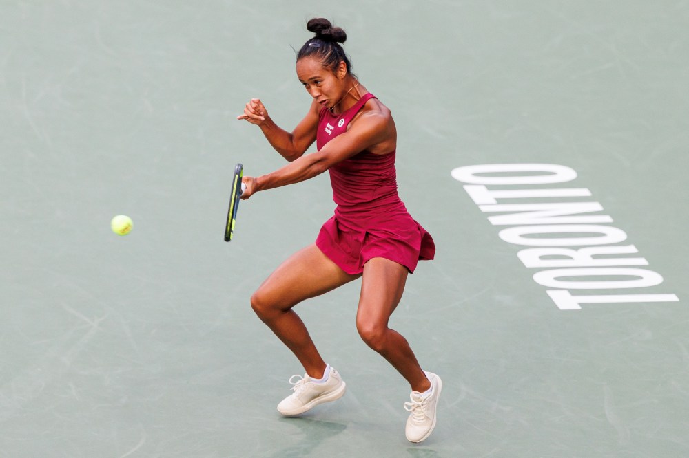 Leylah Fernandez of Canada returns a ball from Naomi Osaka of Japan during Round of 16 National Bank Open tennis action in Toronto on Aug. 9, 2026. THE CANADIAN PRESS/Keito Newman