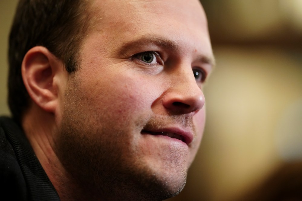 Nathaniel Erskine-Smith talks to reporters as he leaves caucus on Parliament Hill in Ottawa on Wednesday, March 20, 2024. THE CANADIAN PRESS/Sean Kilpatrick