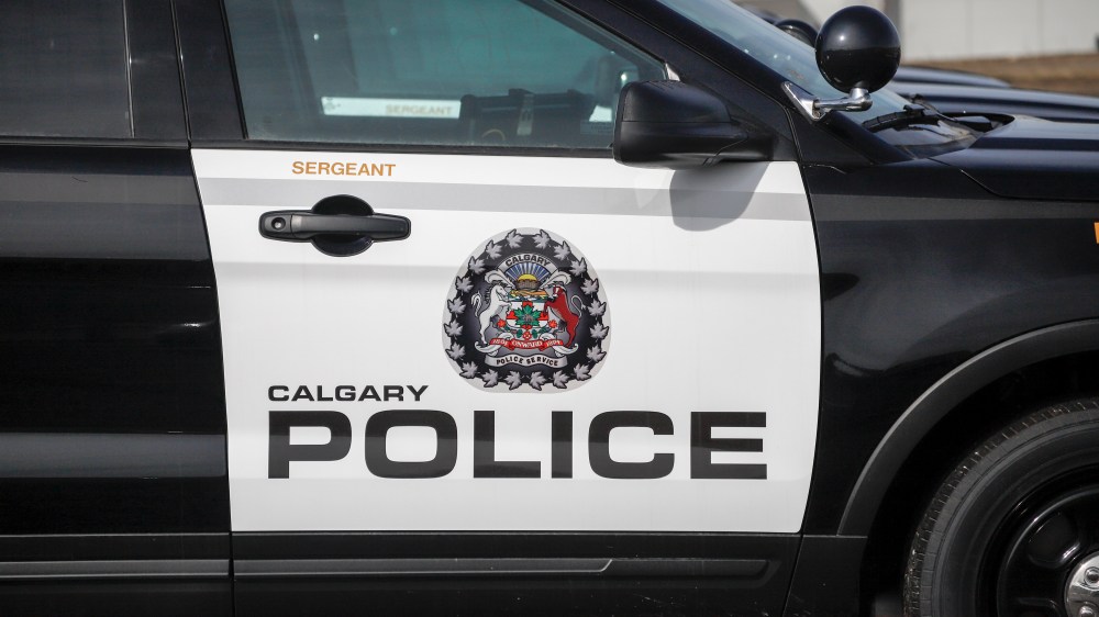 A Calgary Police Service logo is seen on a vehicle parked at headquarters in Calgary on April 9, 2020. A Calgary police officer has been ordered to stand trial for second-degree murder. THE CANADIAN PRESS/Jeff McIntosh