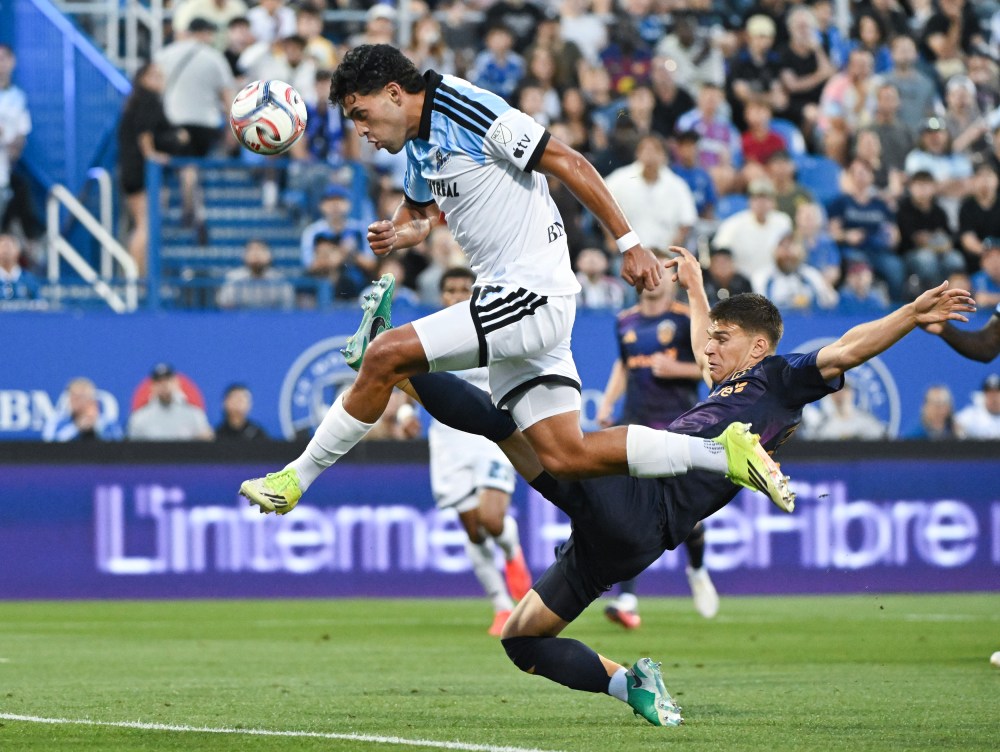 L.A. Galaxy's Harbor Miller, right, defends against CF Montreal's Daniel Rios during first half MLS action in Montreal, on Saturday, Aug. 22, 2026. THE CANADIAN PRESS/Graham Hughes