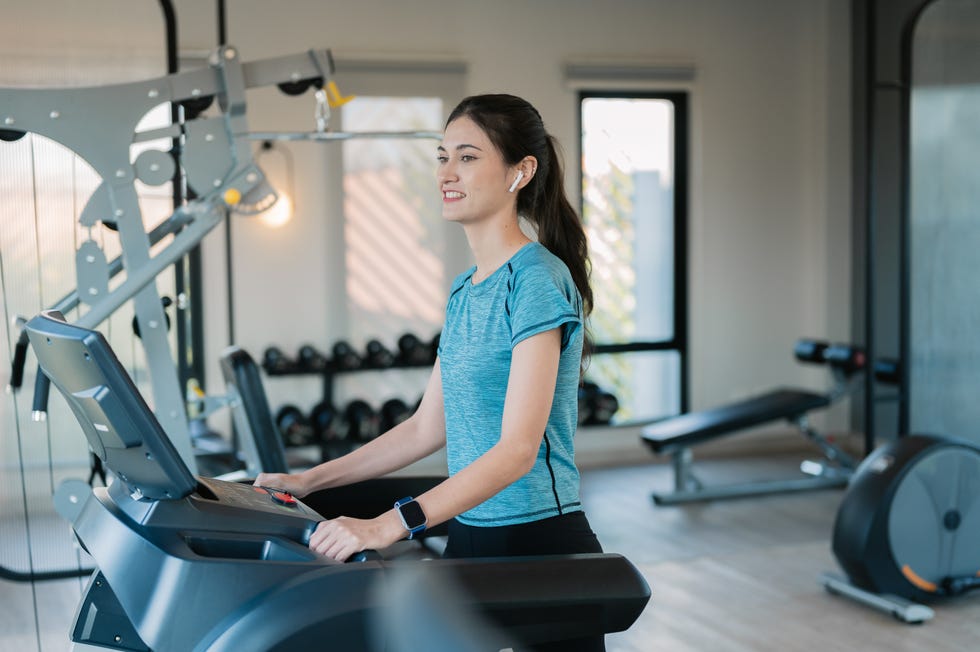 Young woman jogging on the treadmill at the gym. Young woman jogging on the treadmill at the gym.