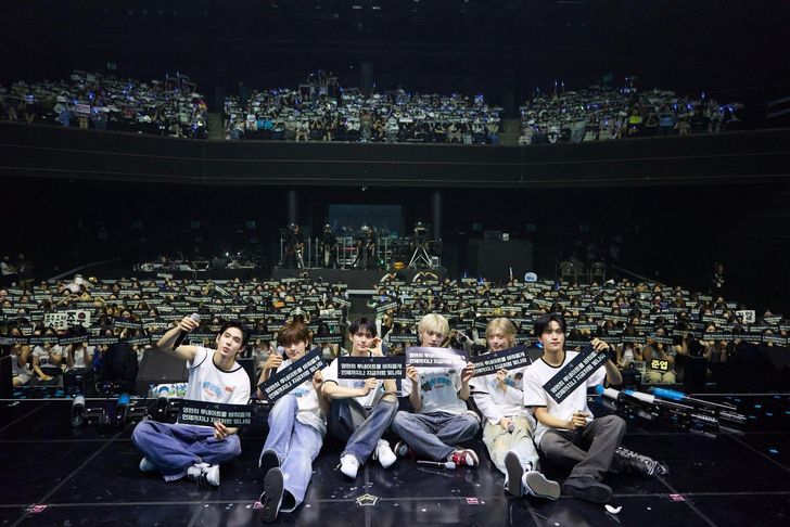 K-pop boy band LUN8 members, from left, Chael, Jinsoo, Ian, Takuma, Yuma and Junwoo, pose with the audience during the band's first solo fan concert at YES24 Live Hall in Seoul's Gwangjin District, Saturday. Captured from LUN8's official X account