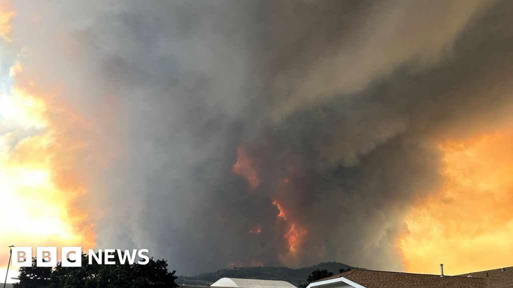 State of emergency declared as fast-moving Canada wildfire doubles in size - BBC