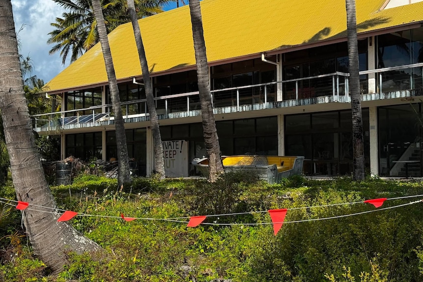 Derelict buildings that were once an island resort.