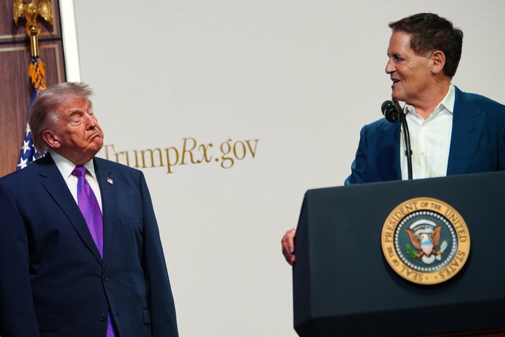 President Donald Trump listens as Mark Cuban speaks about prescription drug prices in the South Court Auditorium in the Eisenhower Executive Office Building on the White House campus, Monday, May 18, 2026, in Washington. (AP Photo/Julia Demaree Nikhinson)
